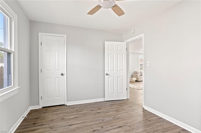 31 W Sunset Rd, Hampton, VA 23669 - unfurnished bedroom with wood finished floors and baseboards