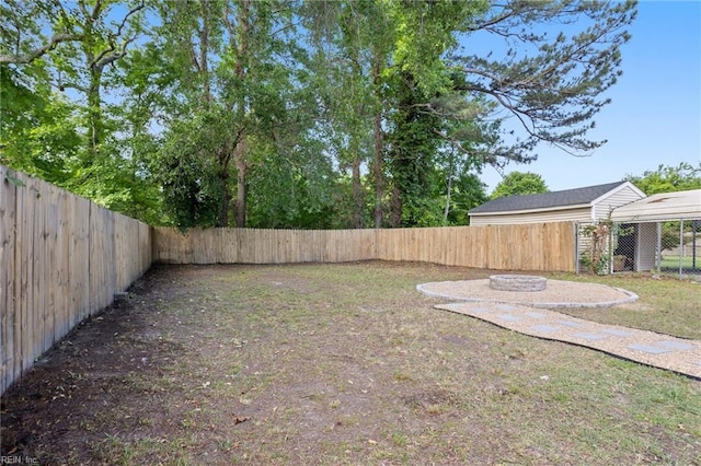 31 W Sunset Rd, Hampton, VA 23669 - fenced backyard with a fire pit