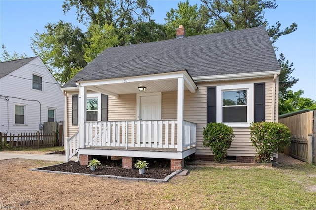 31 W Sunset Rd, Hampton, VA 23669 - view of front of house with covered porch, a shingled roof, and a chimney
