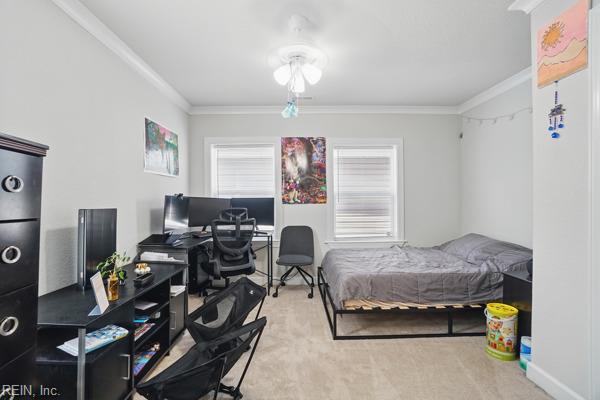 1918 Prentis Ave, Portsmouth, VA 23704 - carpeted bedroom with ornamental molding and an office area