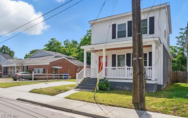 1918 Prentis Ave, Portsmouth, VA 23704 - view of front facade featuring covered porch, a front yard, and board and batten siding