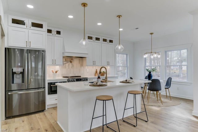 2417 Cedar Rd, Chesapeake, VA 23323 - kitchen with stainless steel fridge, light wood-type flooring, light countertops, a sink, and backsplash