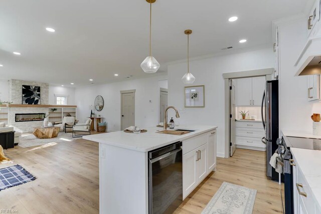 2417 Cedar Rd, Chesapeake, VA 23323 - kitchen with stainless steel appliances, a sink, white cabinetry, open floor plan, and a center island with sink