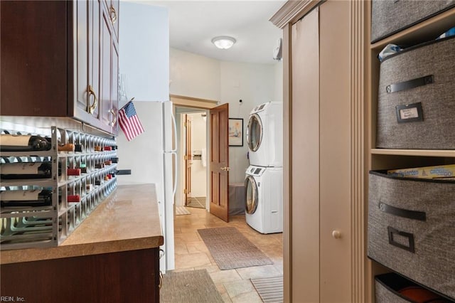 511 Brackenridge Ave, Norfolk, VA 23505 - laundry area featuring stacked washer and clothes dryer and light stone finish flooring