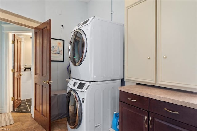 511 Brackenridge Ave, Norfolk, VA 23505 - washroom featuring stacked washer and clothes dryer and cabinet space