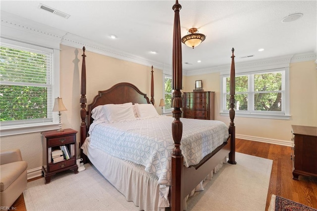 511 Brackenridge Ave, Norfolk, VA 23505 - bedroom with multiple windows, baseboards, wood finished floors, and ornamental molding