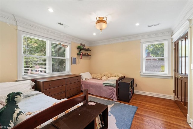 511 Brackenridge Ave, Norfolk, VA 23505 - bedroom featuring crown molding, multiple windows, wood finished floors, baseboards, and recessed lighting