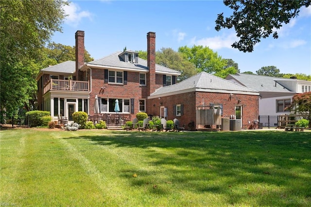 511 Brackenridge Ave, Norfolk, VA 23505 - rear view of property with a balcony, a chimney, brick siding, and central AC unit