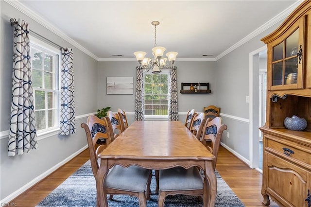 8 Assembly Ct, Newport News, VA 23606 - dining space featuring plenty of natural light, a chandelier, light wood-style flooring, baseboards, and ornamental molding
