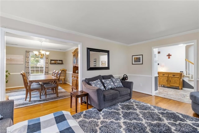 8 Assembly Ct, Newport News, VA 23606 - living room featuring a chandelier, light wood-type flooring, ornamental molding, stairs, and baseboards