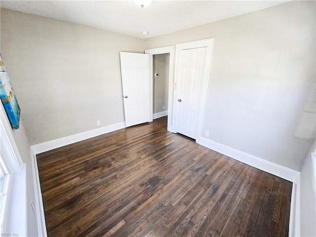 1251 Little Bay Ave, Norfolk, VA 23503 - unfurnished bedroom with dark wood finished floors, baseboards, and a closet