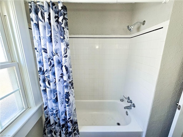 1251 Little Bay Ave, Norfolk, VA 23503 - bathroom with shower / bath combo with shower curtain, healthy amount of natural light, and a textured wall