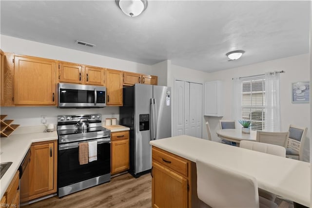 3012 Trappers Run, Chesapeake, VA 23321 - kitchen featuring stainless steel appliances, light wood-style flooring, and light countertops