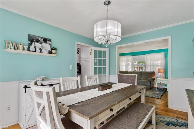 5801 Lancelot Dr, Virginia Beach, VA 23464 - dining area featuring crown molding, a chandelier, and wood finished floors