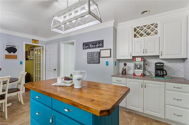 5801 Lancelot Dr, Virginia Beach, VA 23464 - kitchen featuring wooden counters, white cabinets, ornamental molding, and tasteful backsplash