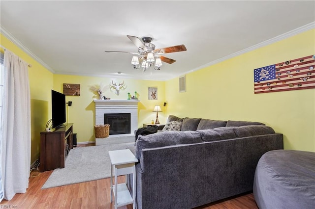 5801 Lancelot Dr, Virginia Beach, VA 23464 - living area featuring ornamental molding, wood finished floors, a ceiling fan, and a fireplace