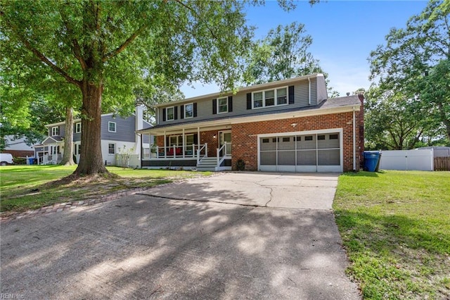 5801 Lancelot Dr, Virginia Beach, VA 23464 - traditional-style house with a porch, brick siding, concrete driveway, and a chimney