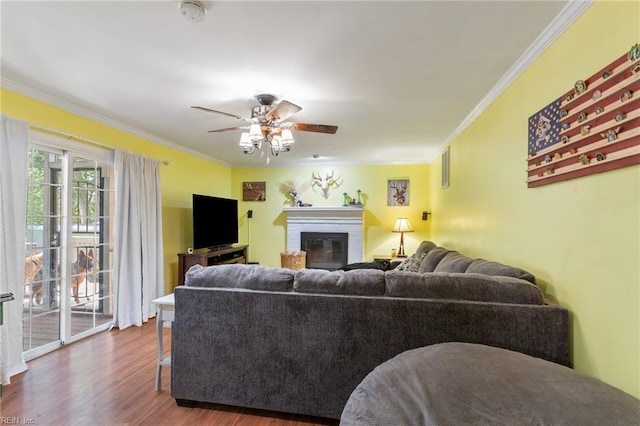 5801 Lancelot Dr, Virginia Beach, VA 23464 - living room featuring ornamental molding, ceiling fan, wood finished floors, and a brick fireplace