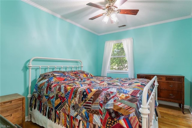 5801 Lancelot Dr, Virginia Beach, VA 23464 - bedroom featuring crown molding, wood finished floors, baseboards, and ceiling fan