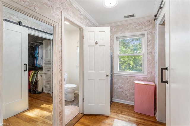 5801 Lancelot Dr, Virginia Beach, VA 23464 - full bathroom with toilet, wood finished floors, ornamental molding, wallpapered walls, and a walk in closet