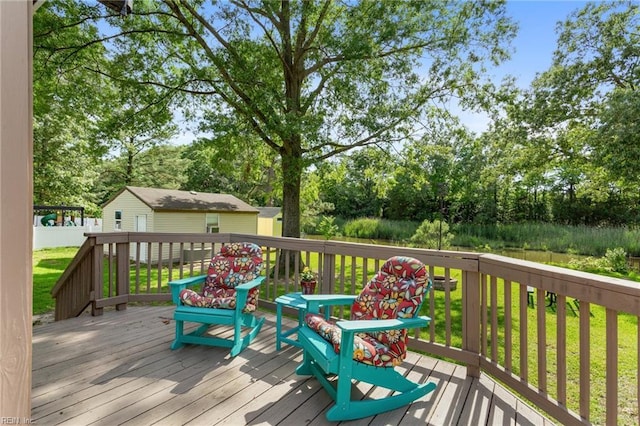 5801 Lancelot Dr, Virginia Beach, VA 23464 - wooden deck with an outdoor structure, a lawn, and view of scattered trees