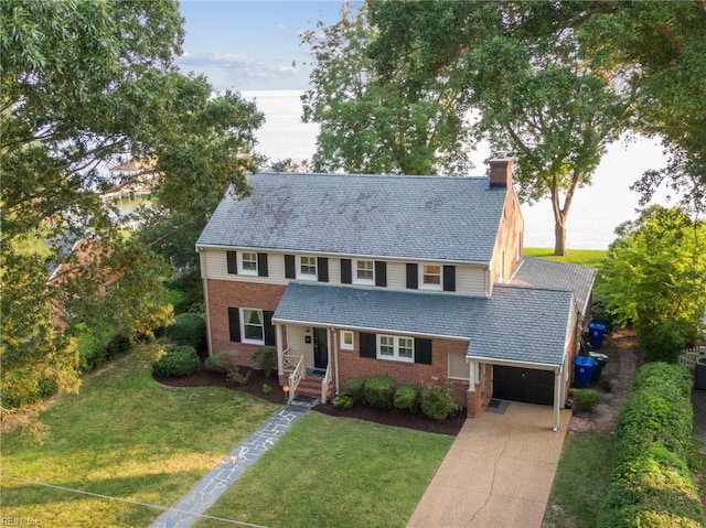 609 River Rd, Newport News, VA 23601 - view of front of house with a garage, brick siding, a chimney, and a front lawn