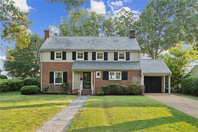 609 River Rd, Newport News, VA 23601 - view of front of property with a chimney, an attached garage, brick siding, a front yard, and concrete driveway