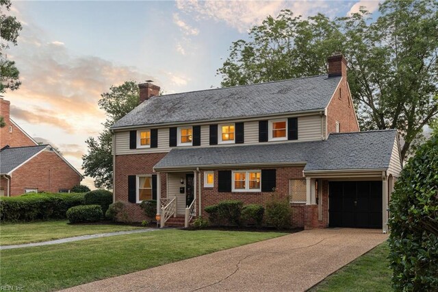 609 River Rd, Newport News, VA 23601 - view of front of property featuring a chimney, brick siding, a garage, driveway, and a front lawn