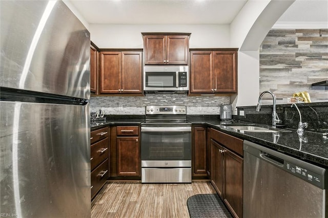 418 Fishers Ct, Hampton, VA 23666 - kitchen with stainless steel appliances, a sink, dark stone counters, and backsplash