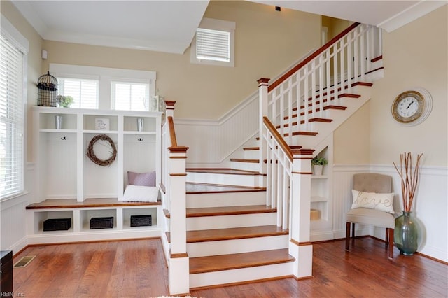 3304 Dodd Dr, Chesapeake, VA 23323 - stairway featuring wood finished floors, a wainscoted wall, and a decorative wall