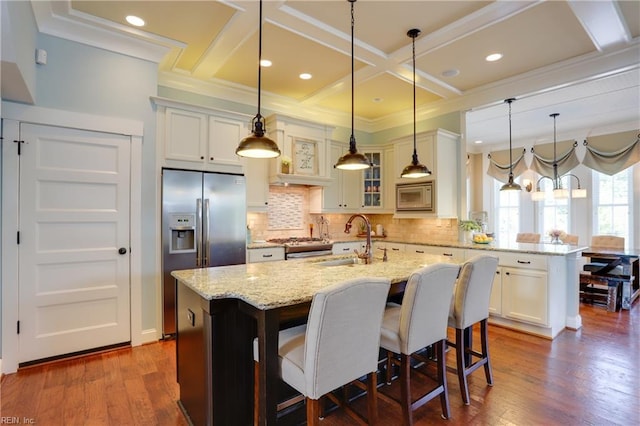 3304 Dodd Dr, Chesapeake, VA 23323 - kitchen with stainless steel appliances, a sink, a peninsula, coffered ceiling, and glass insert cabinets