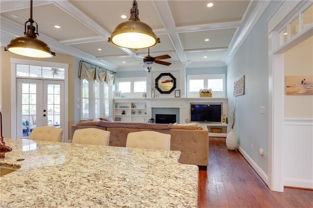 3304 Dodd Dr, Chesapeake, VA 23323 - dining area featuring ceiling fan, healthy amount of natural light, coffered ceiling, a large fireplace, and dark wood-style floors