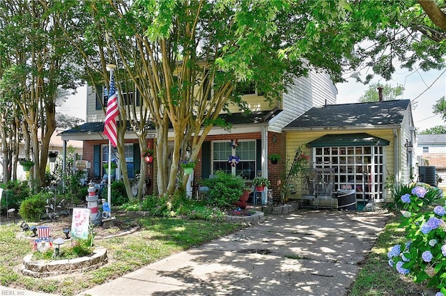 505 Stockton St, Hampton, VA 23669 - obstructed view of property featuring brick siding and central air condition unit