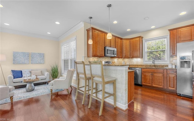 3964 W Stratford Rd, Virginia Beach, VA 23455 - kitchen featuring stainless steel appliances, dark wood-type flooring, open floor plan, decorative backsplash, and crown molding