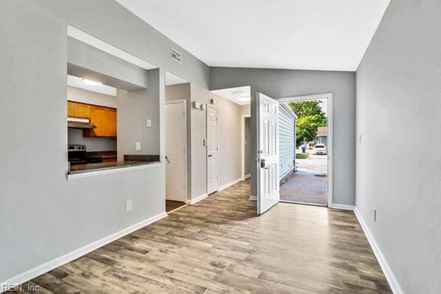 1342 W 39th St, Norfolk, VA 23508 - foyer entrance featuring wood finished floors, baseboards, and lofted ceiling