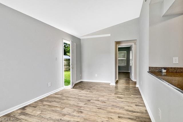 1342 W 39th St, Norfolk, VA 23508 - unfurnished room featuring lofted ceiling, wood finished floors, and baseboards