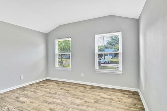 1342 W 39th St, Norfolk, VA 23508 - unfurnished room featuring vaulted ceiling, wood finished floors, and baseboards