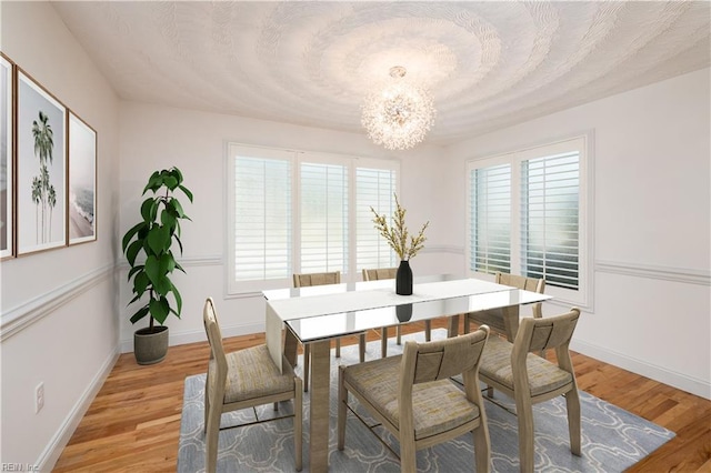536 Virginia Ave, Virginia Beach, VA 23451 - dining room featuring a chandelier, light wood finished floors, and baseboards