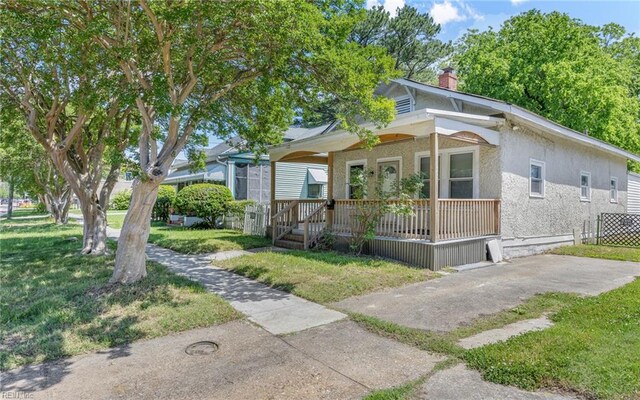 2532 Ballentine Blvd, Norfolk, VA 23509 - view of front facade featuring covered porch, a front yard, and a chimney