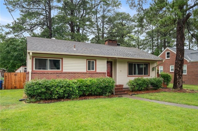 8 Llewellyn St, Portsmouth, VA 23707 - view of front of house featuring brick siding and a chimney