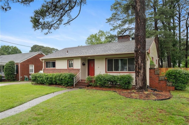 8 Llewellyn St, Portsmouth, VA 23707 - single story home with a front yard, a chimney, and brick siding