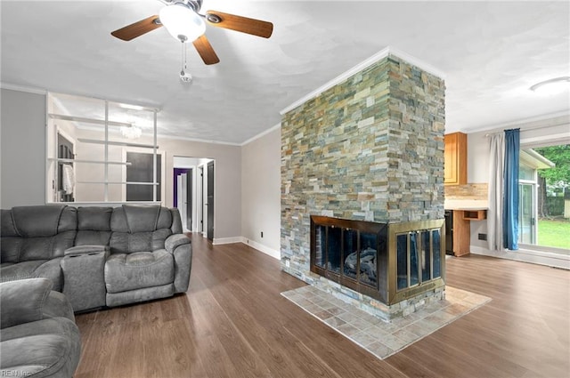 8 Llewellyn St, Portsmouth, VA 23707 - living room with crown molding, a ceiling fan, wood finished floors, baseboards, and a fireplace