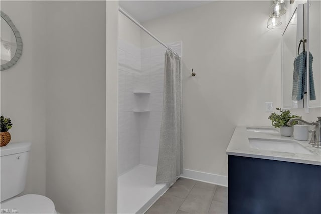 1028 W 36th St, Norfolk, VA 23508 - full bathroom featuring toilet, tile patterned flooring, a tile shower, double vanity, and baseboards
