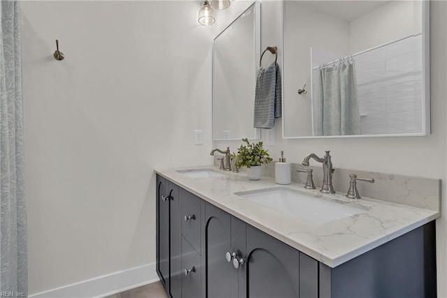 1028 W 36th St, Norfolk, VA 23508 - bathroom featuring double vanity, baseboards, and a shower with shower curtain