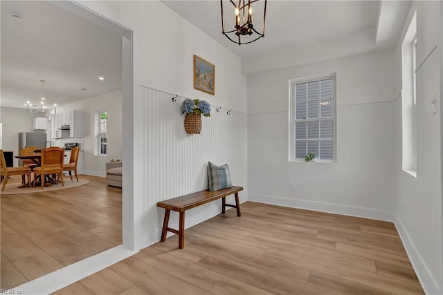 1028 W 36th St, Norfolk, VA 23508 - foyer entrance featuring a chandelier, light wood-style floors, and baseboards