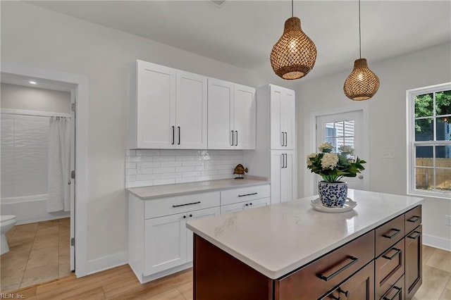 1028 W 36th St, Norfolk, VA 23508 - kitchen featuring light countertops, baseboards, and white cabinets