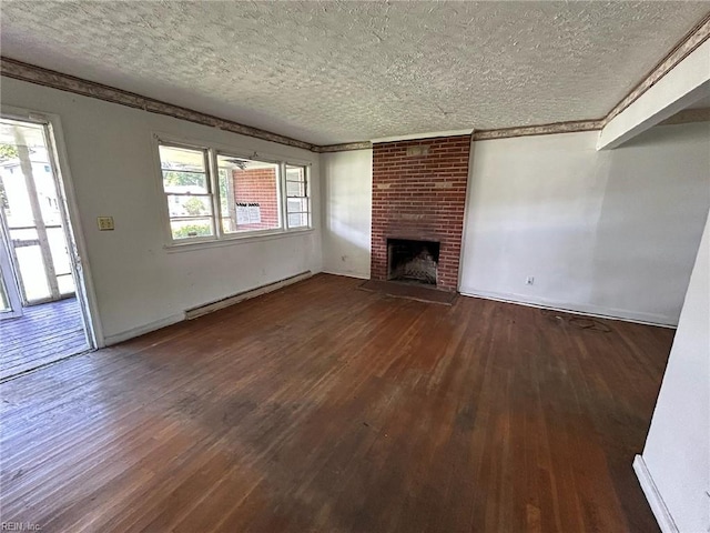 1702 Marshall Ave, Newport News, VA 23607 - unfurnished living room with a baseboard heating unit, a textured ceiling, dark wood-style flooring, a brick fireplace, and baseboards