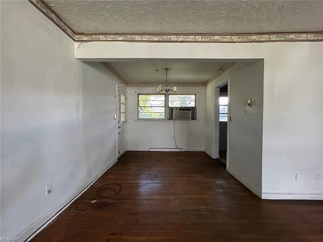 1702 Marshall Ave, Newport News, VA 23607 - unfurnished dining area featuring a chandelier, a textured ceiling, wood finished floors, baseboards, and cooling unit