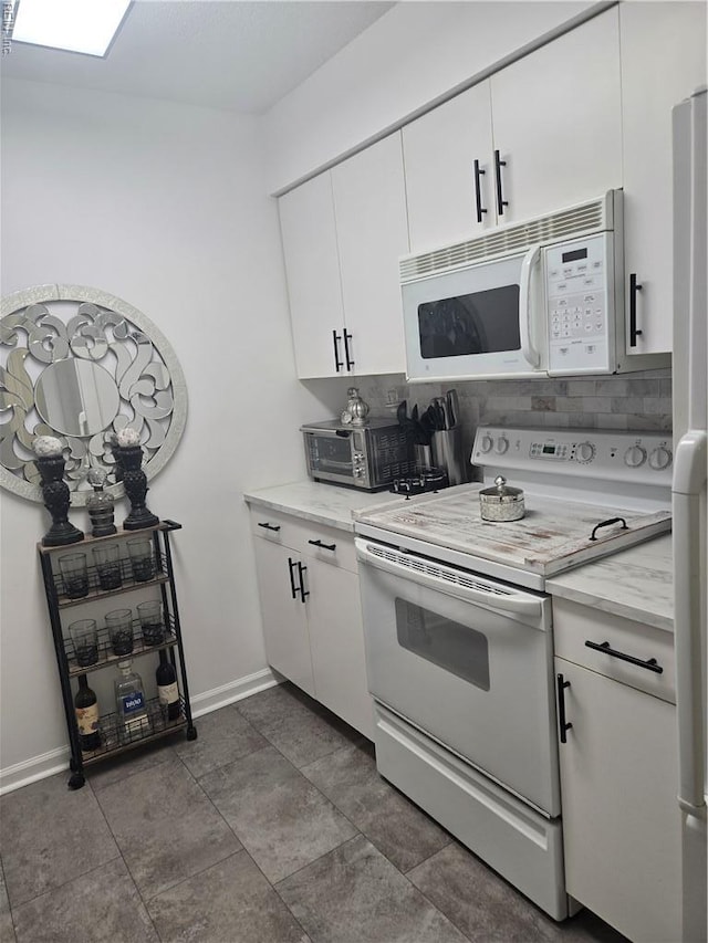 1507 Queens Xing, Williamsburg, VA 23185 - kitchen featuring white appliances, baseboards, and white cabinets