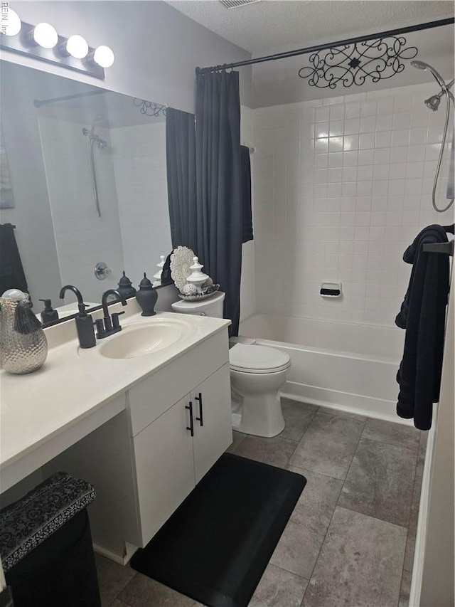 1507 Queens Xing, Williamsburg, VA 23185 - full bathroom featuring vanity, shower / bath combo with shower curtain, toilet, and a textured ceiling